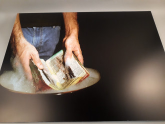 Public rituals (Hands washing a book)